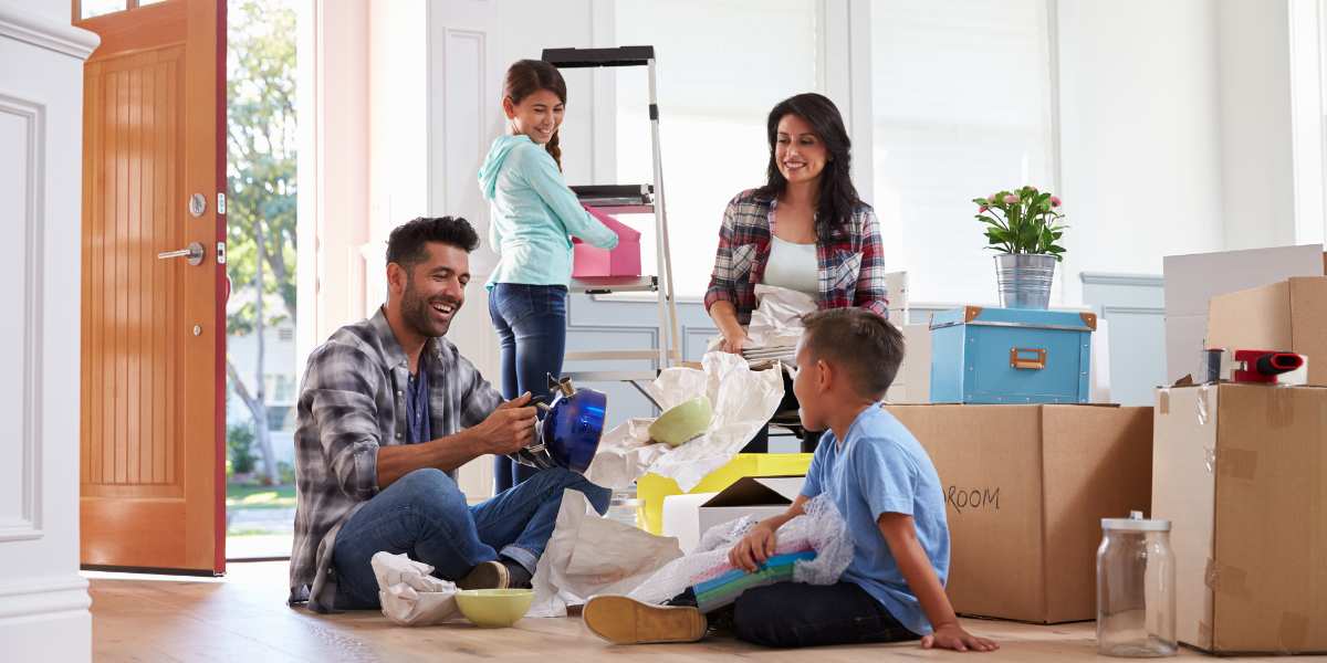 family unpacking at new house