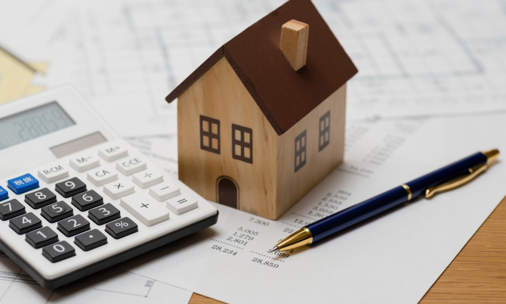 Automated Valuation Models Blog post picture - CFPB Ruling - Automated Valuation Models, house with calculator in image